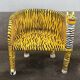 Wooden armchair with a "tiger" appearance.