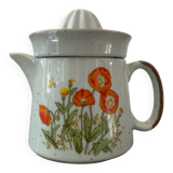 Vintage stoneware jug and its citrus juicer.