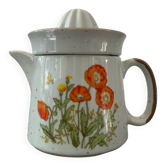 Vintage stoneware jug and its citrus juicer.