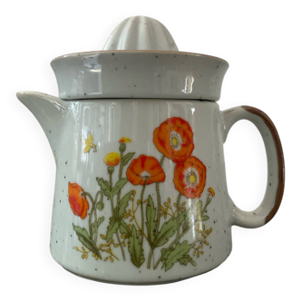 Vintage stoneware jug and its citrus juicer.