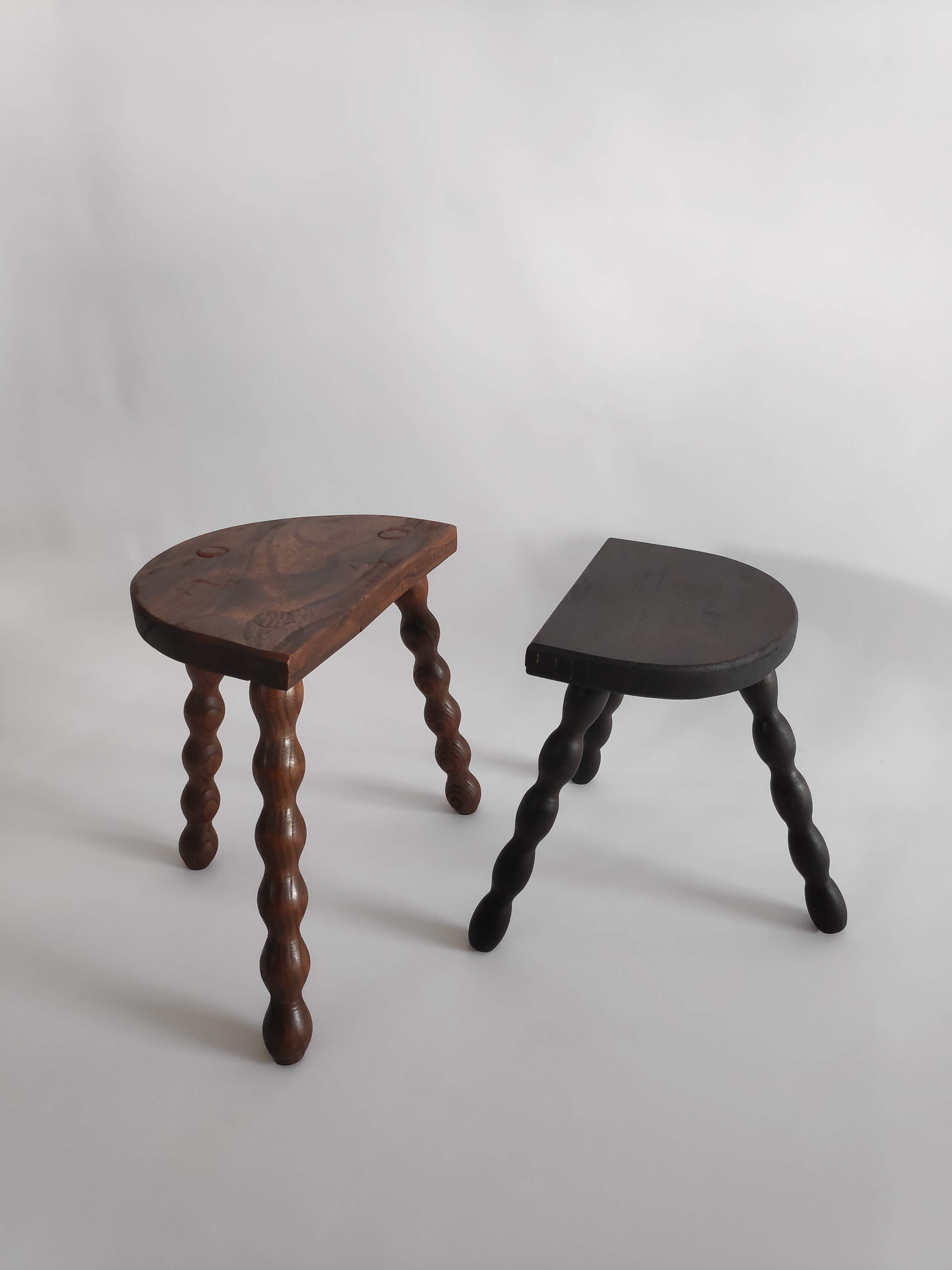 Pair of vintage tripod stools with turned wooden feet