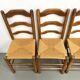 Set of 8 chairs in solid elm with straw seats.