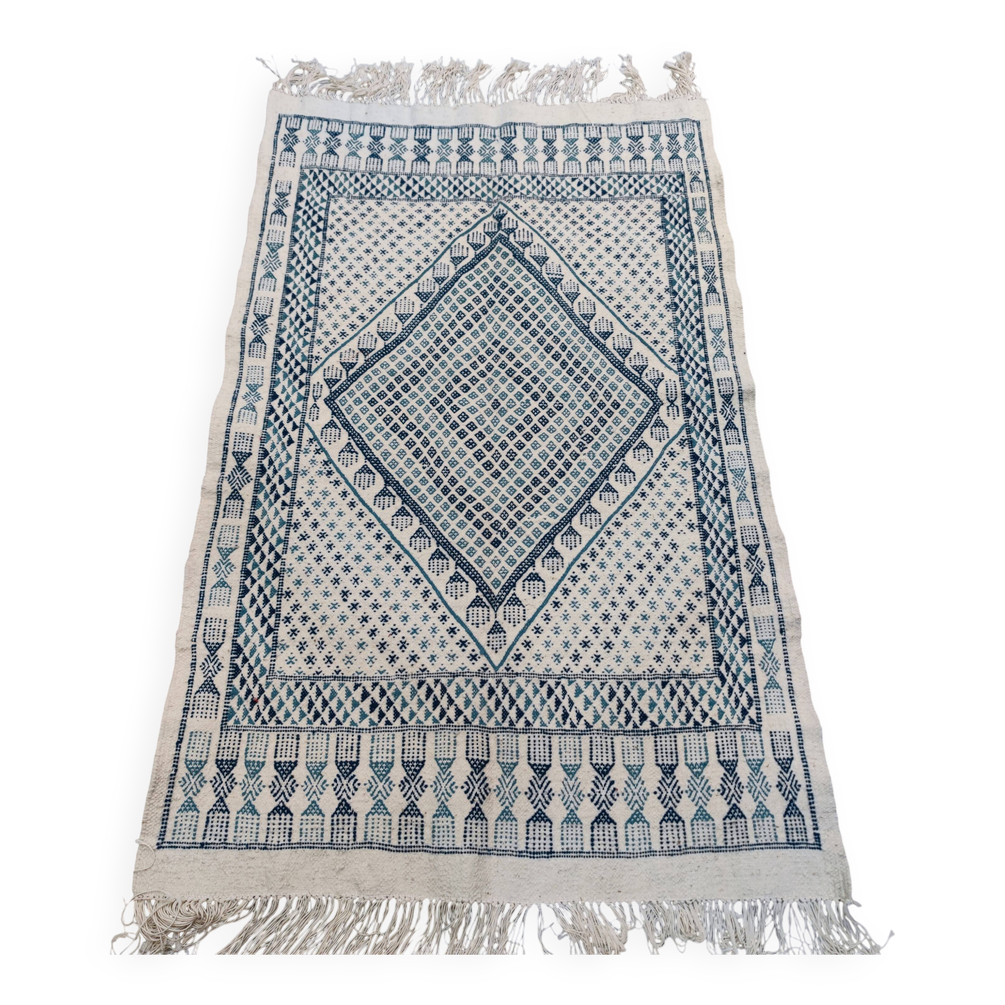 White and blue handwoven rug in natural wool