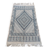 White and blue handwoven rug in natural wool