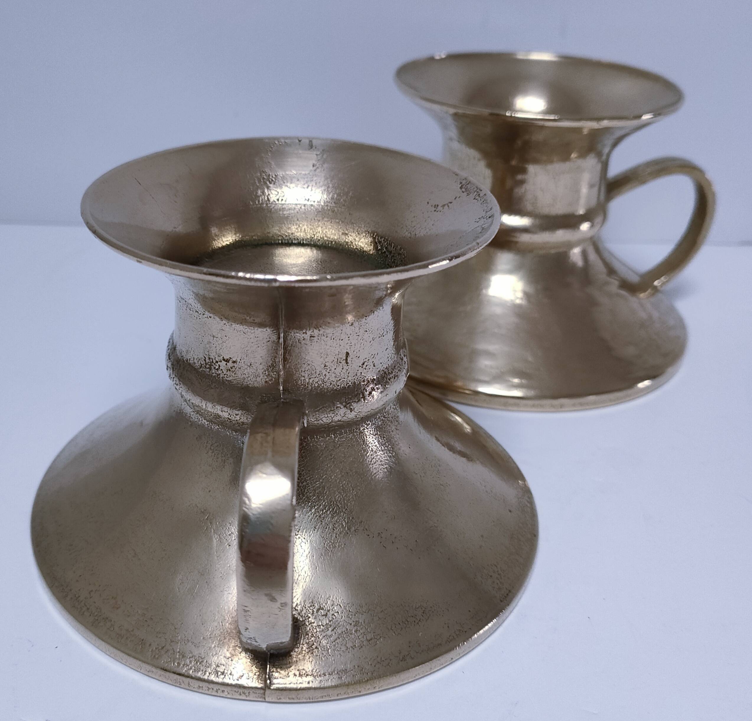 Pair of vintage solid brass hand candlesticks