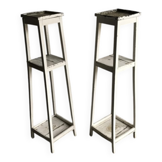 Two white vintage mid-20th century wooden plant stands, 3-tier shelves.