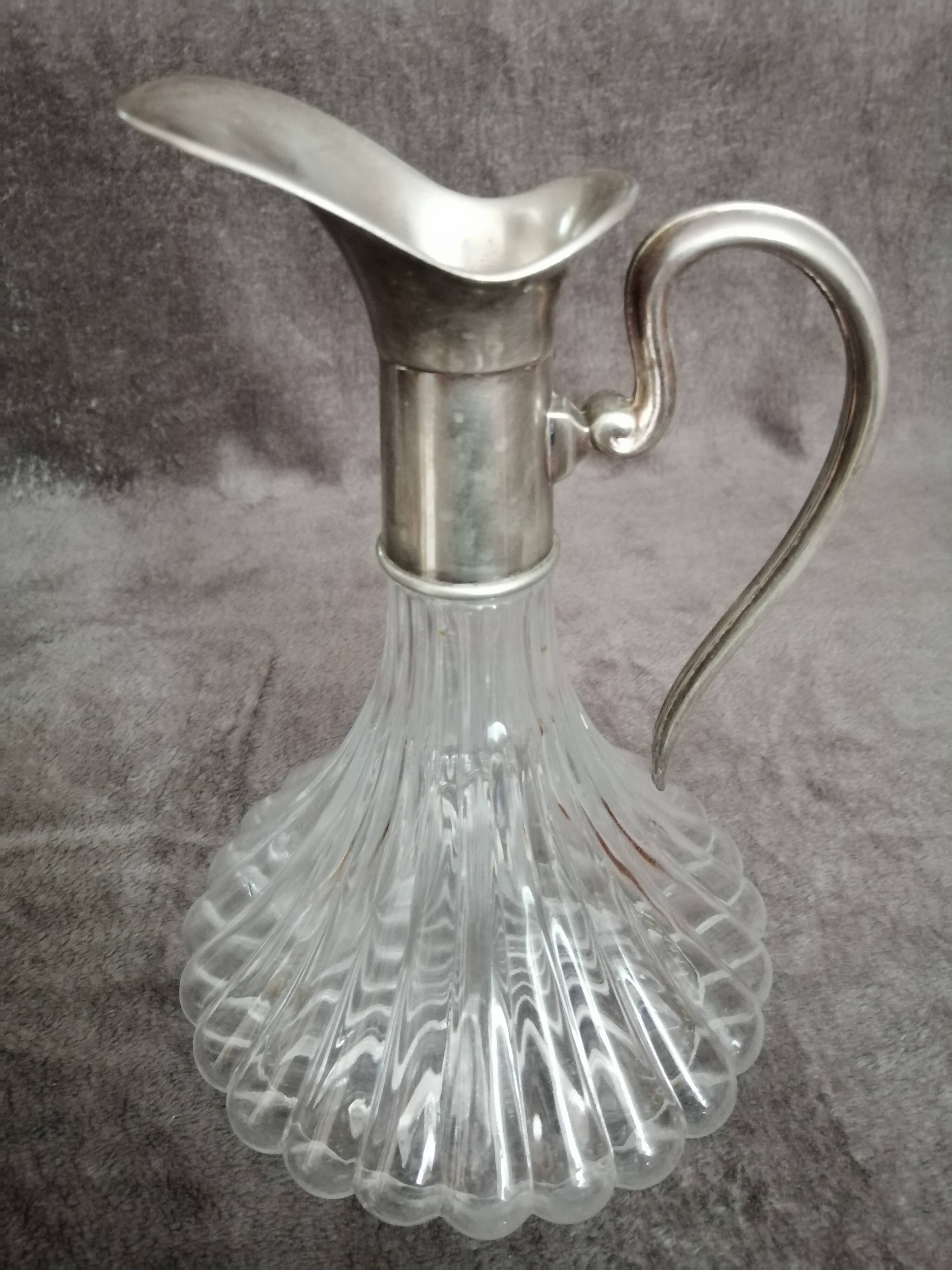 Glass and silver metal wine carafe