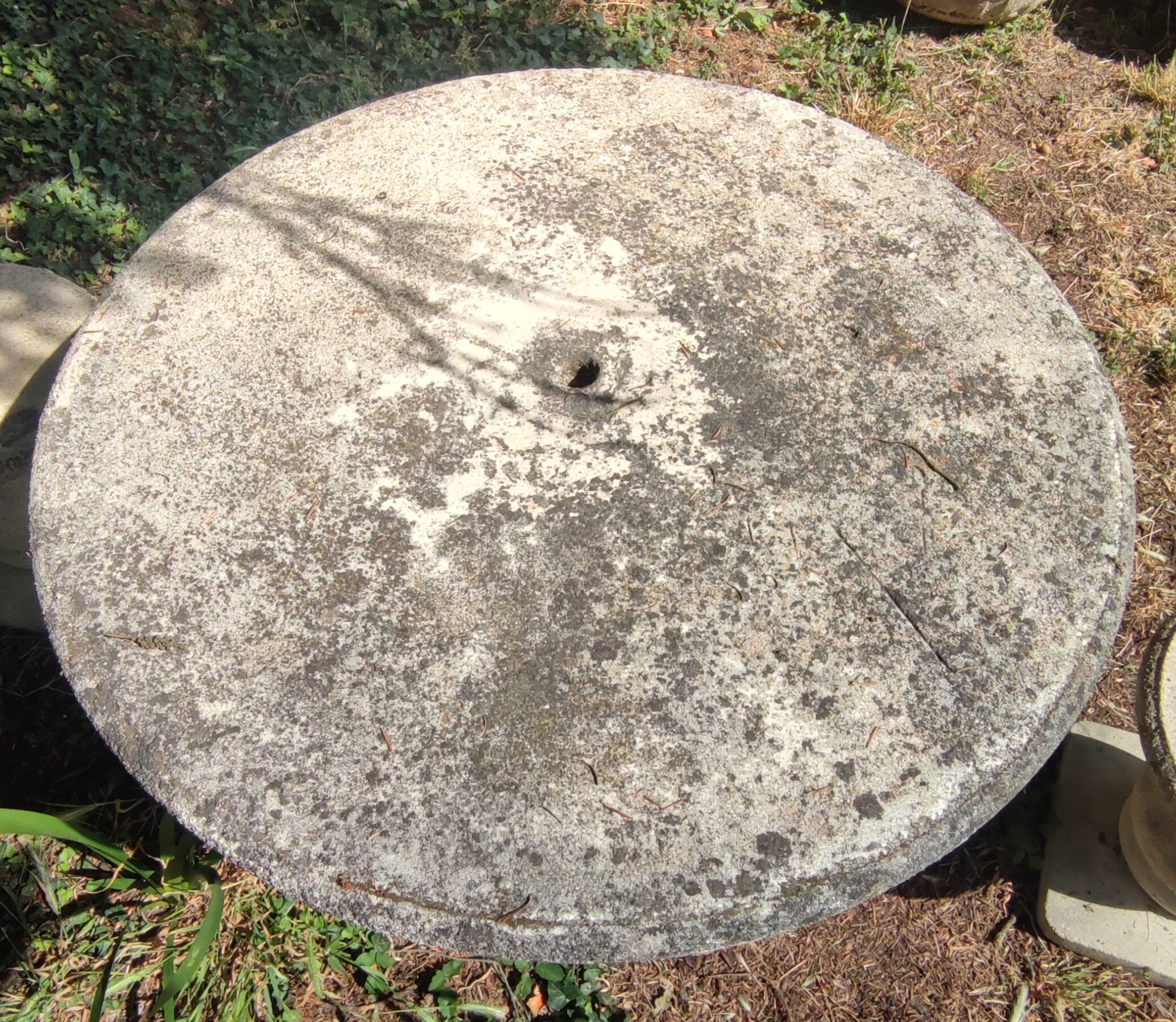 Old garden furniture in reconstituted stone