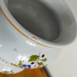 Vintage antique pharmacy jar in earthenware floral patterns