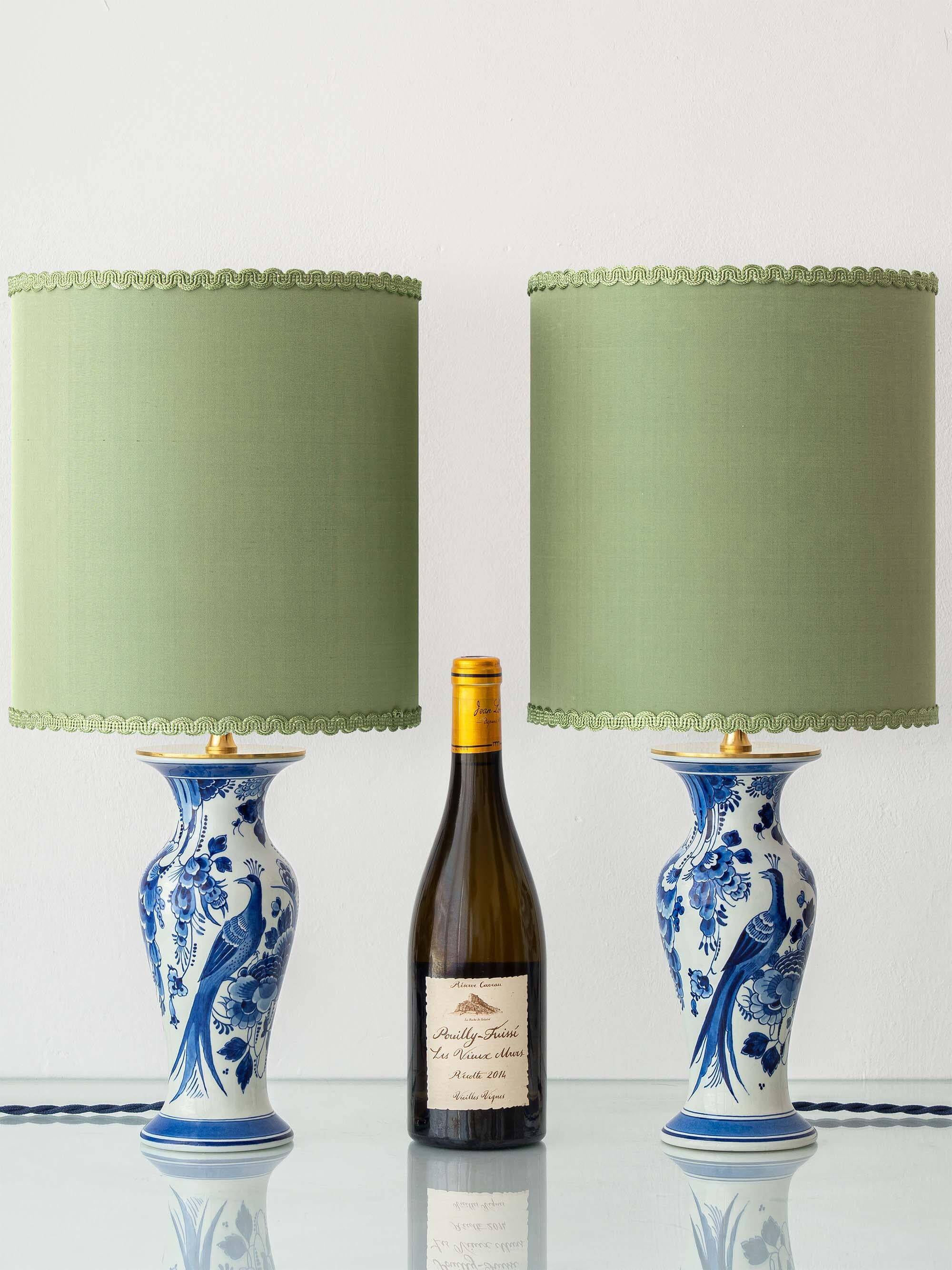 Pair of Chinese table lamps in Delft blue ceramic with new green silk shades.