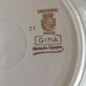 4 mismatched flat plates with floral patterns. Porcelain. Stamped