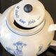 White porcelain teapot decorated with animals