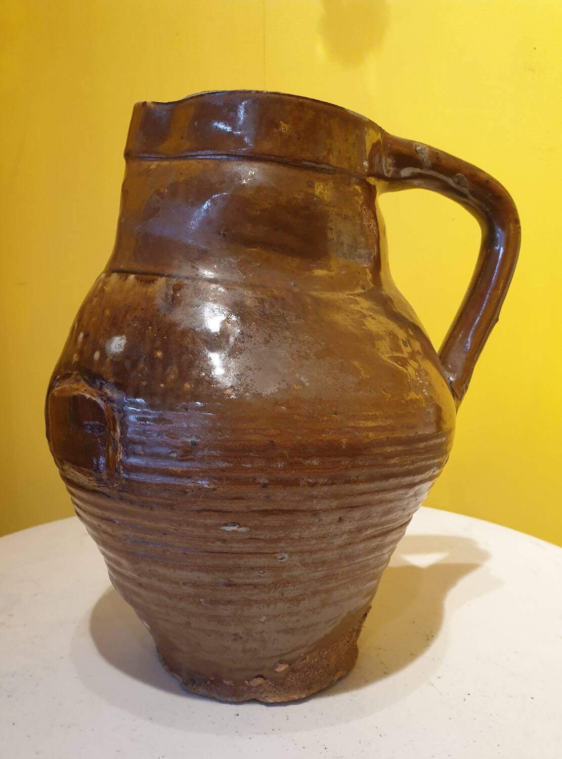 Varnished terracotta pitcher from the 19th century.
