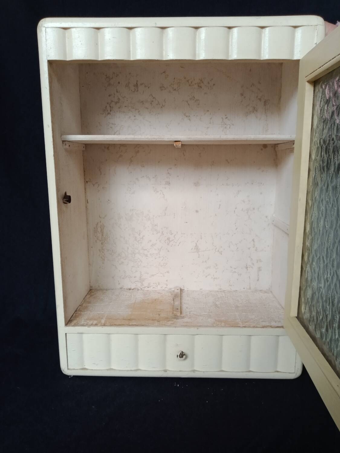 Old wall cabinet with one door and one drawer