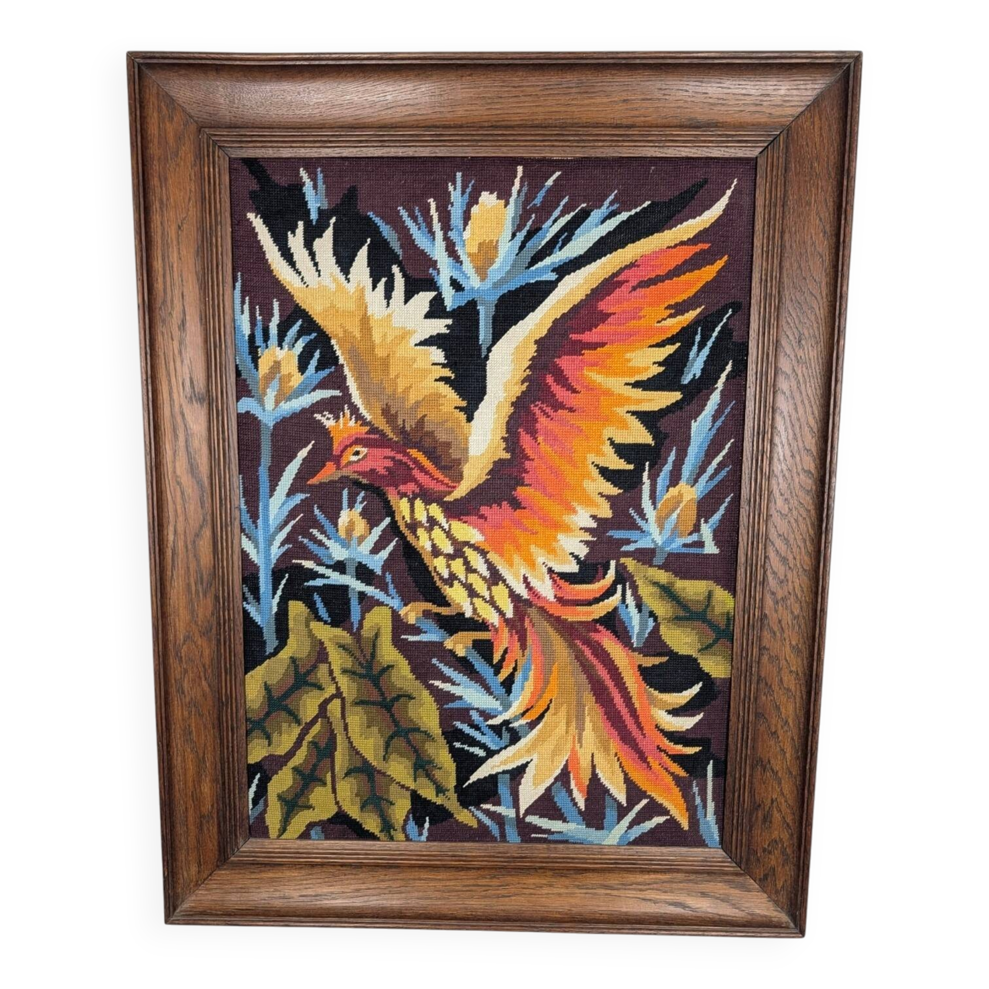 Framed embroidered canvas of a firebird.