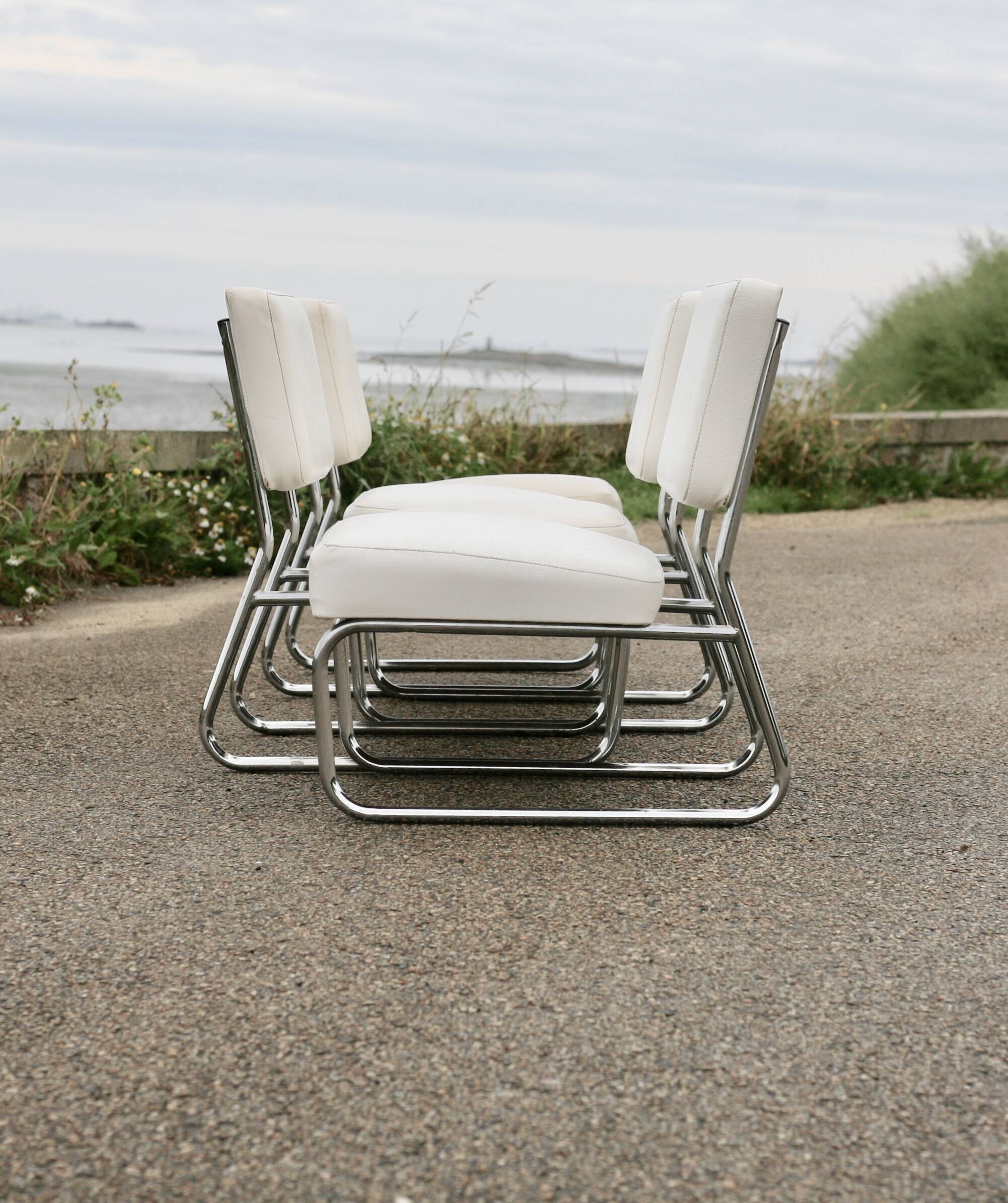 4 armchairs forming a modular sofa. Steel, imitation leather, 70s