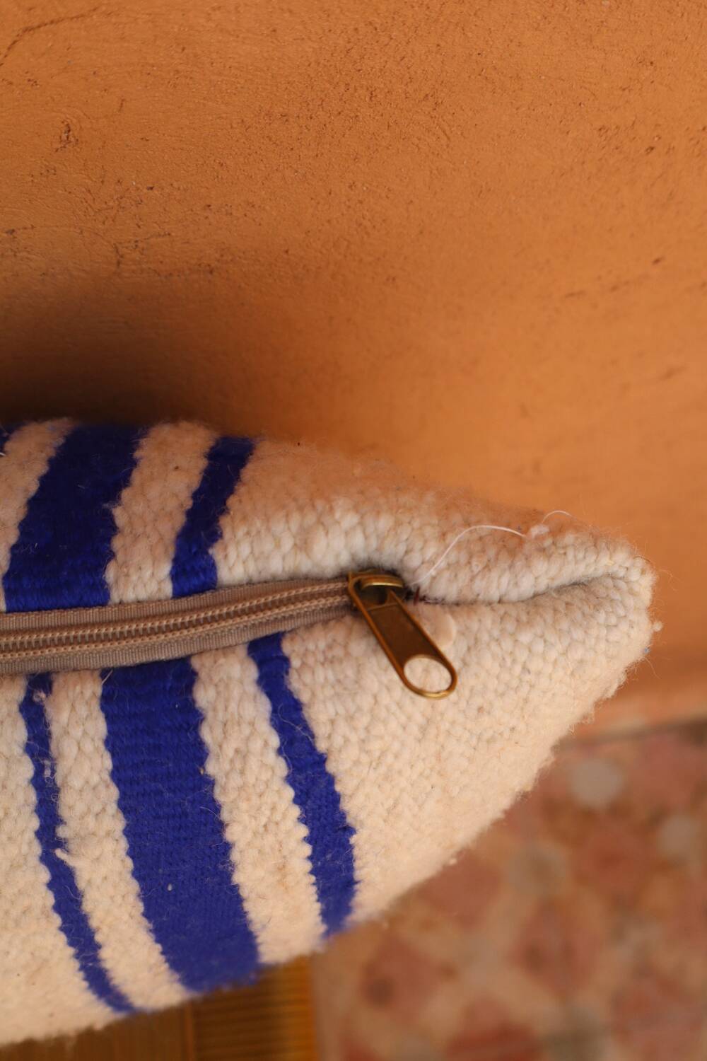 Blue and white striped wool cushion