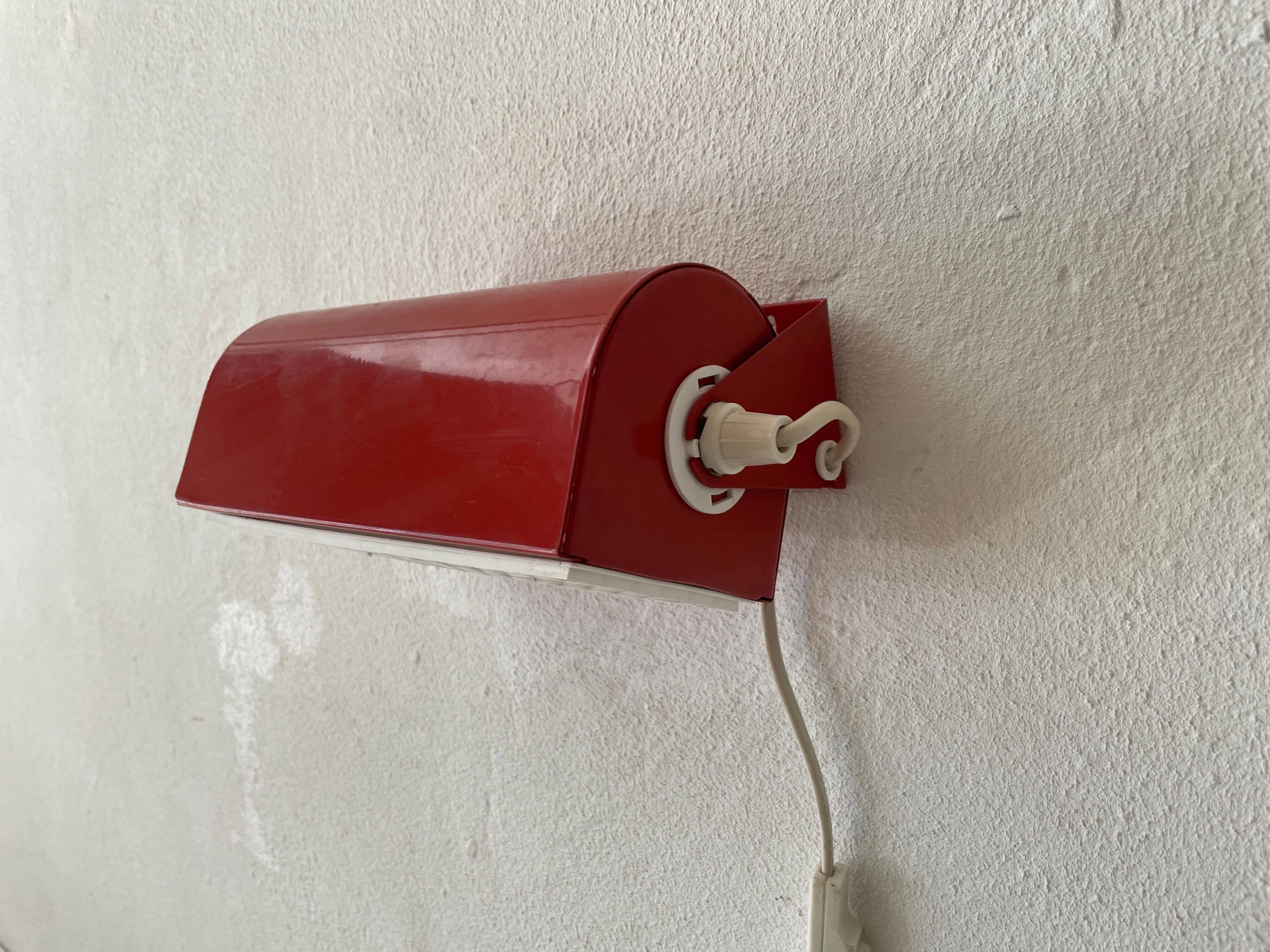 Simple red metal wall light from the AGE, 1970s, Germany.