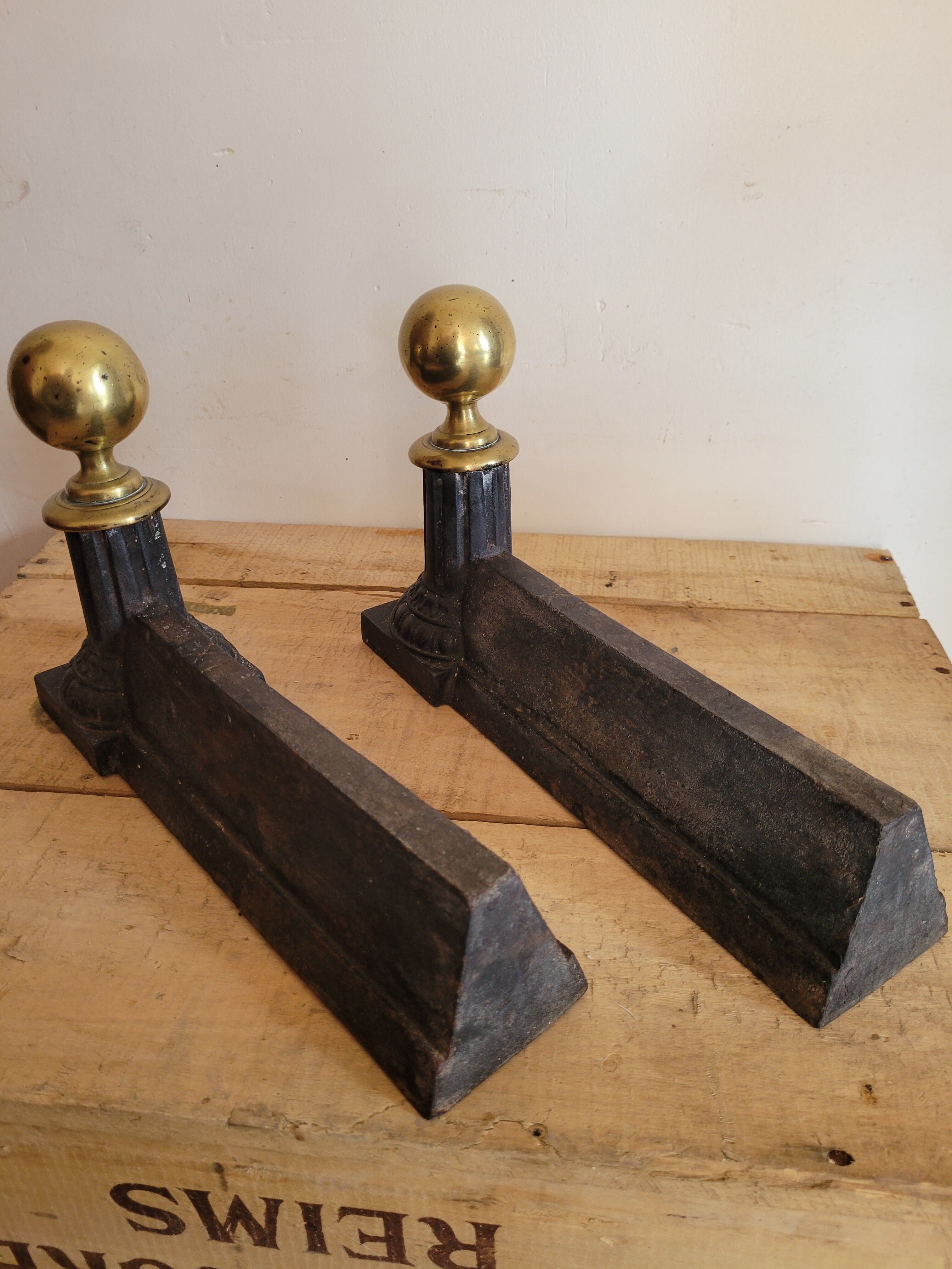 Pair of cast iron and brass chenets