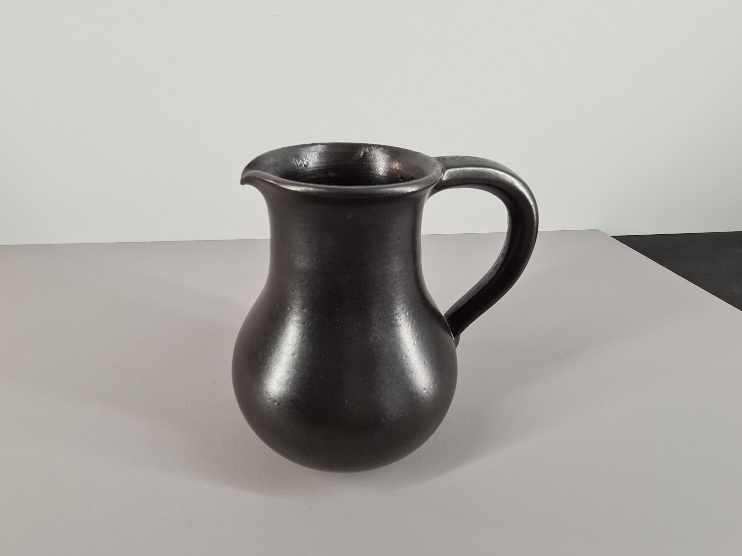 Modernist pitcher in black ceramic 50s