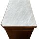 Antique Louis Philippe style chest of drawers with a white marble top.