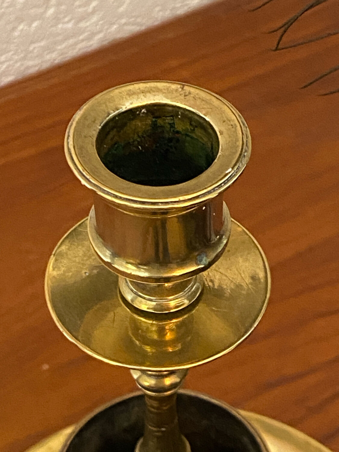 Compartmentalised brass candlestick