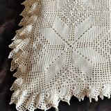 White cotton bedspread, crocheted sofa throw with star patterns