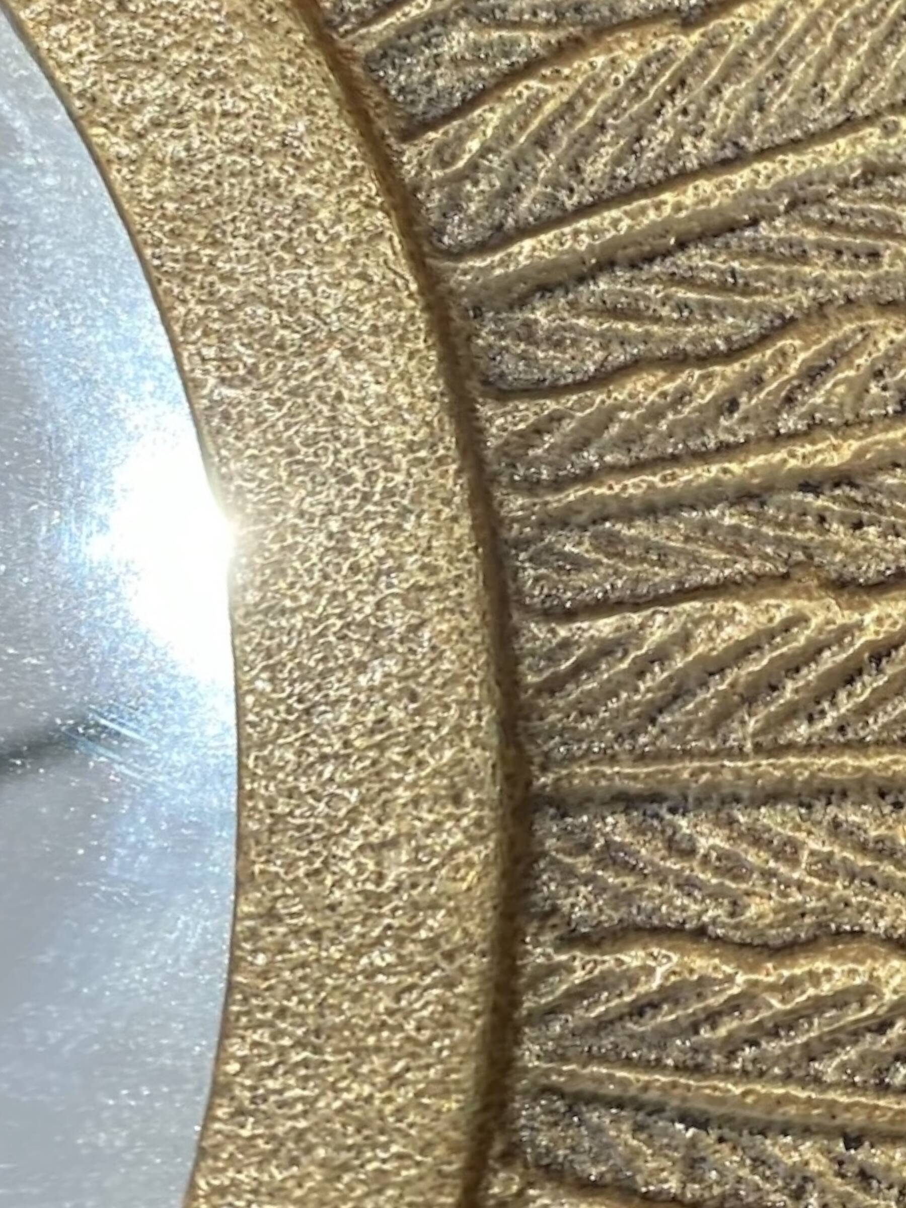 Golden metal sun mirror