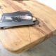 Organic brutalist coffee table in solid cedar, trunk pedestal, 1970s.