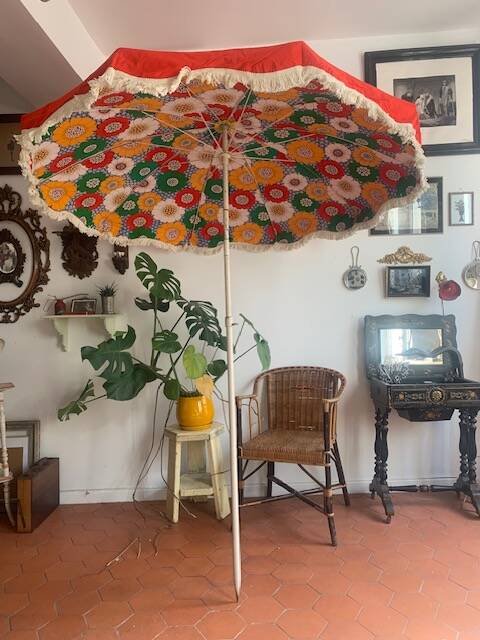 Large floral tilting beach umbrella with cotton fringes, 1960