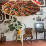 Large floral tilting beach umbrella with cotton fringes, 1960