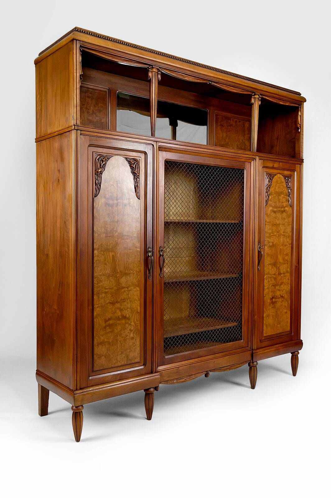 Art Deco showcase bookcase in carved walnut, France, circa 1925
