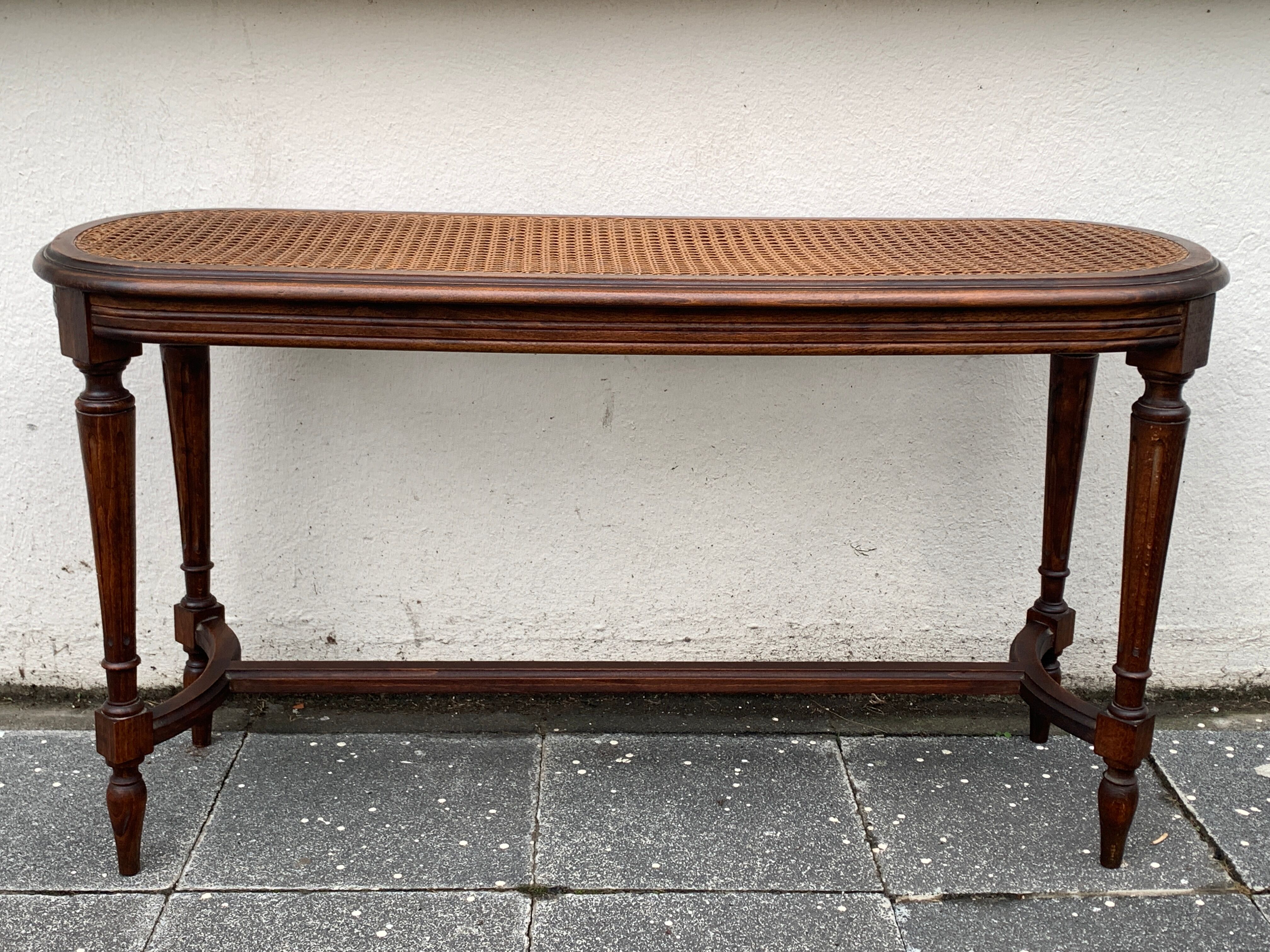Old wooden bench and cannage, Louis XVI style