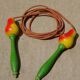 Old wooden jump rope toy painted in the shape of pear fruit ref