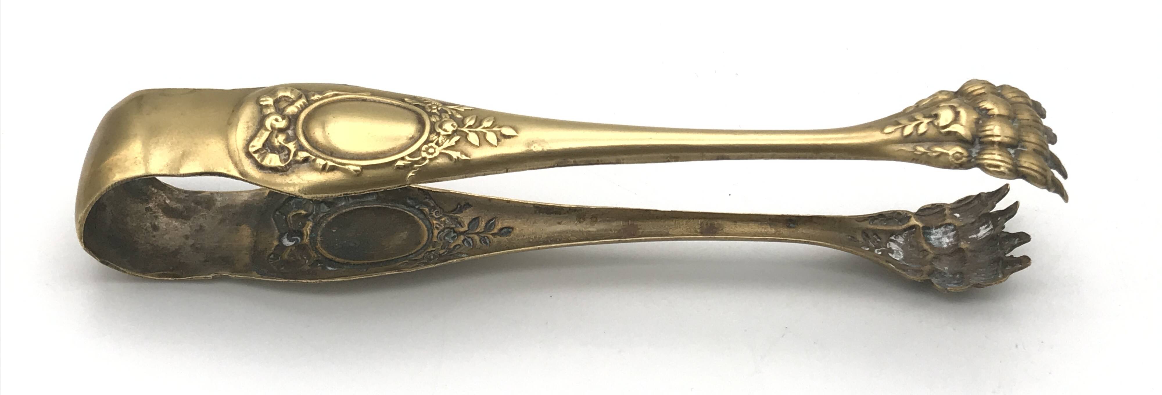 Sugar or ice cube tongs, gold star stamp with lion paw finish