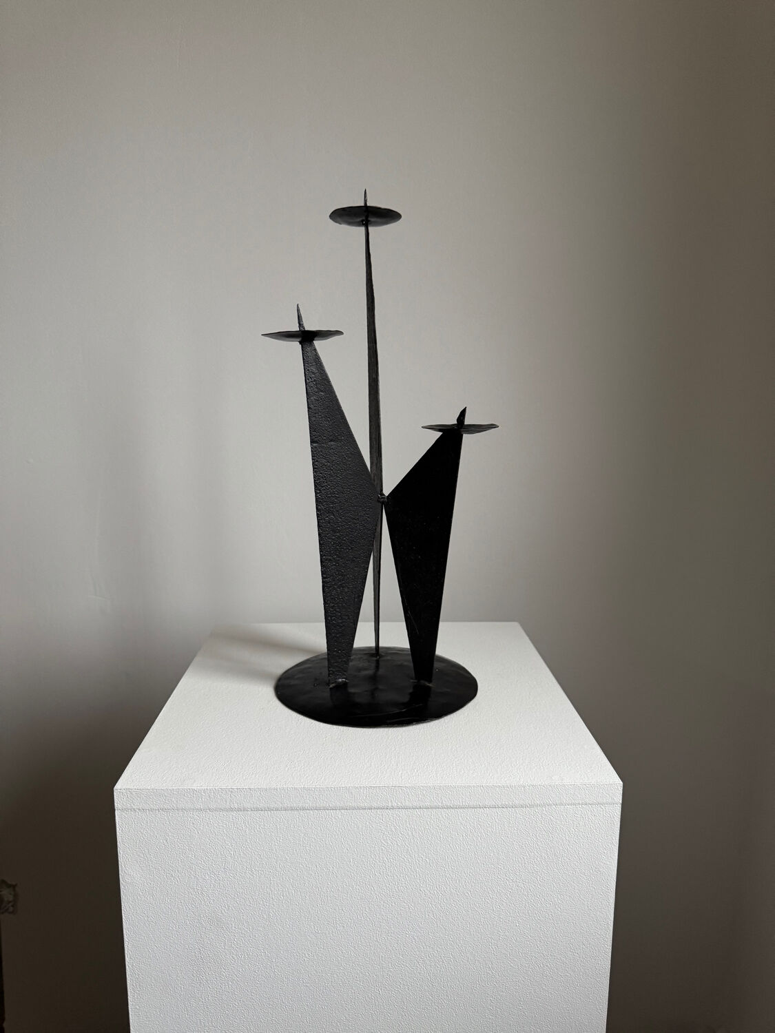 Vintage black metal brutalist tripod candlestick
