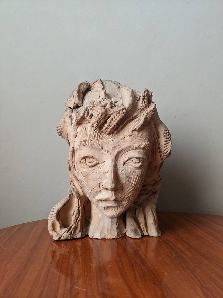 Handmade clay terracotta sculpture head decoration workshop