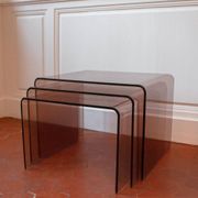 Vintage trio of nesting tables in smoked plexiglass by Michel Dumas, year.