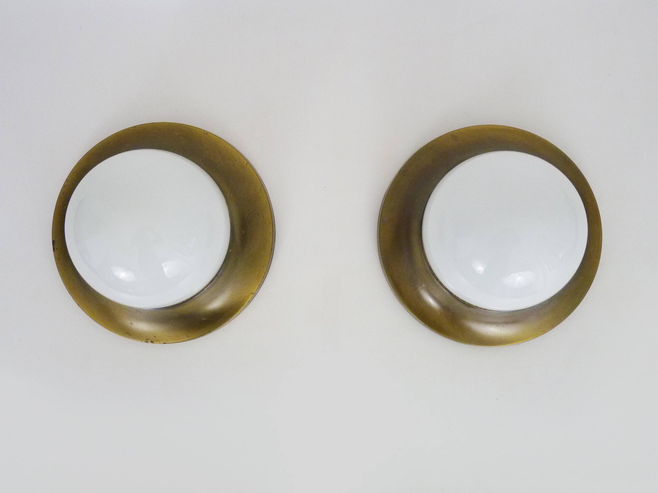 Pair of Space age wall lights made in Austria, Opaline gold metal. UFO