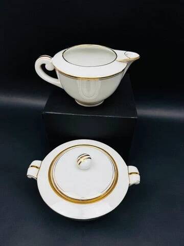 Limoges porcelain A. Vignaud sugar bowl and milk jug with gold trim