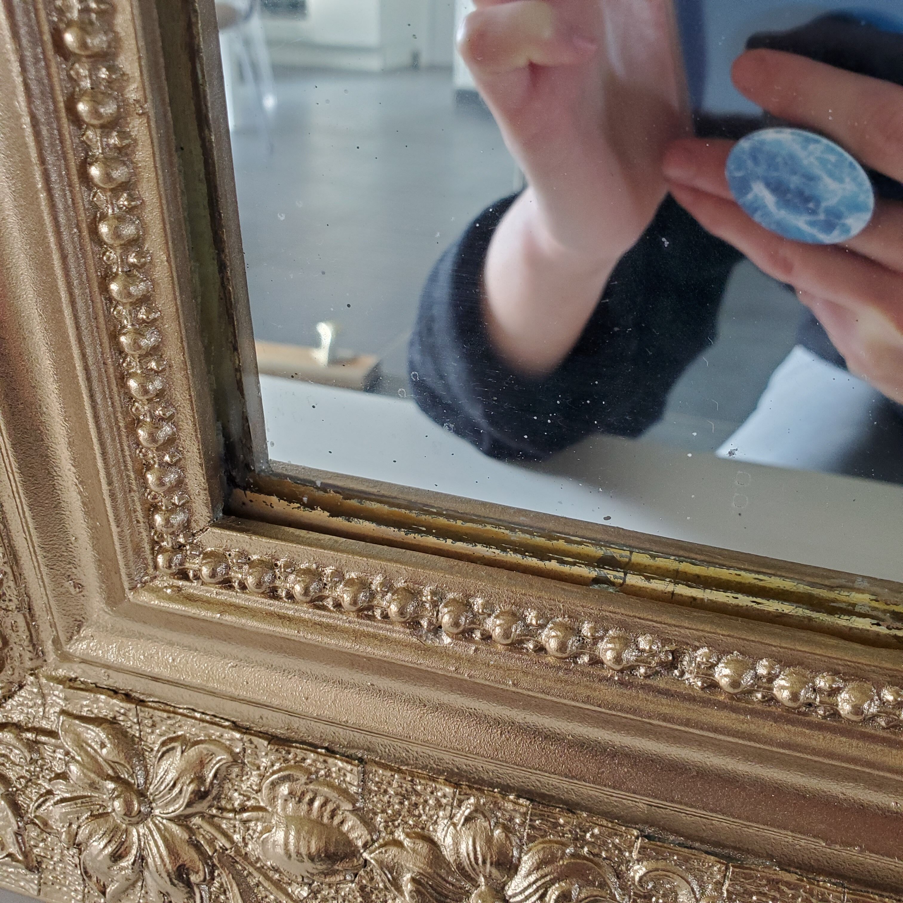 Antique mirror with gilded wood crests