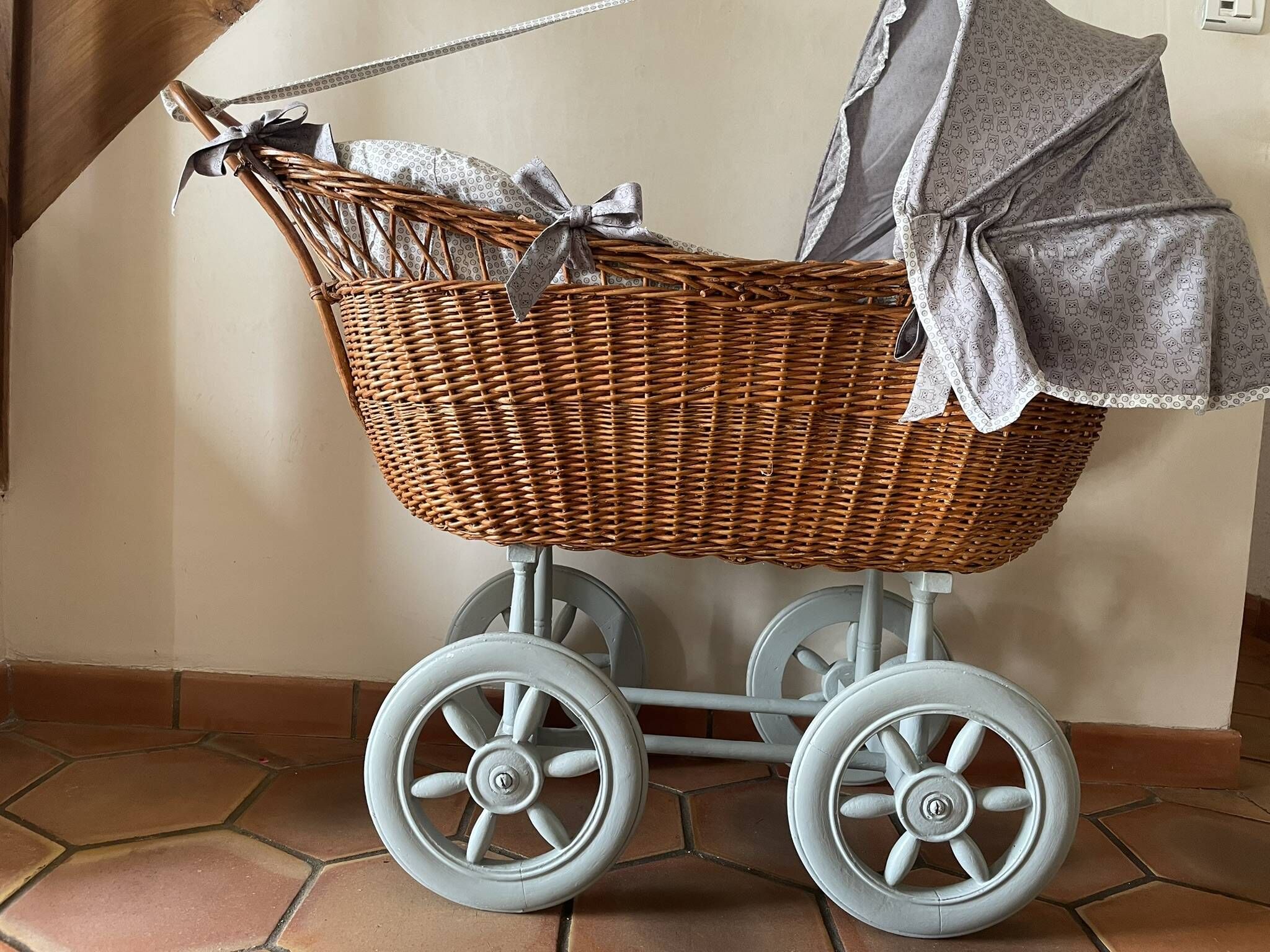Antique rattan cradle in very good condition. Sold with or without upholstery.