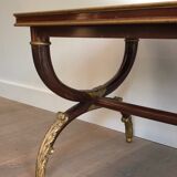 Coffee table in patinated and gilded carved wood with mirror top