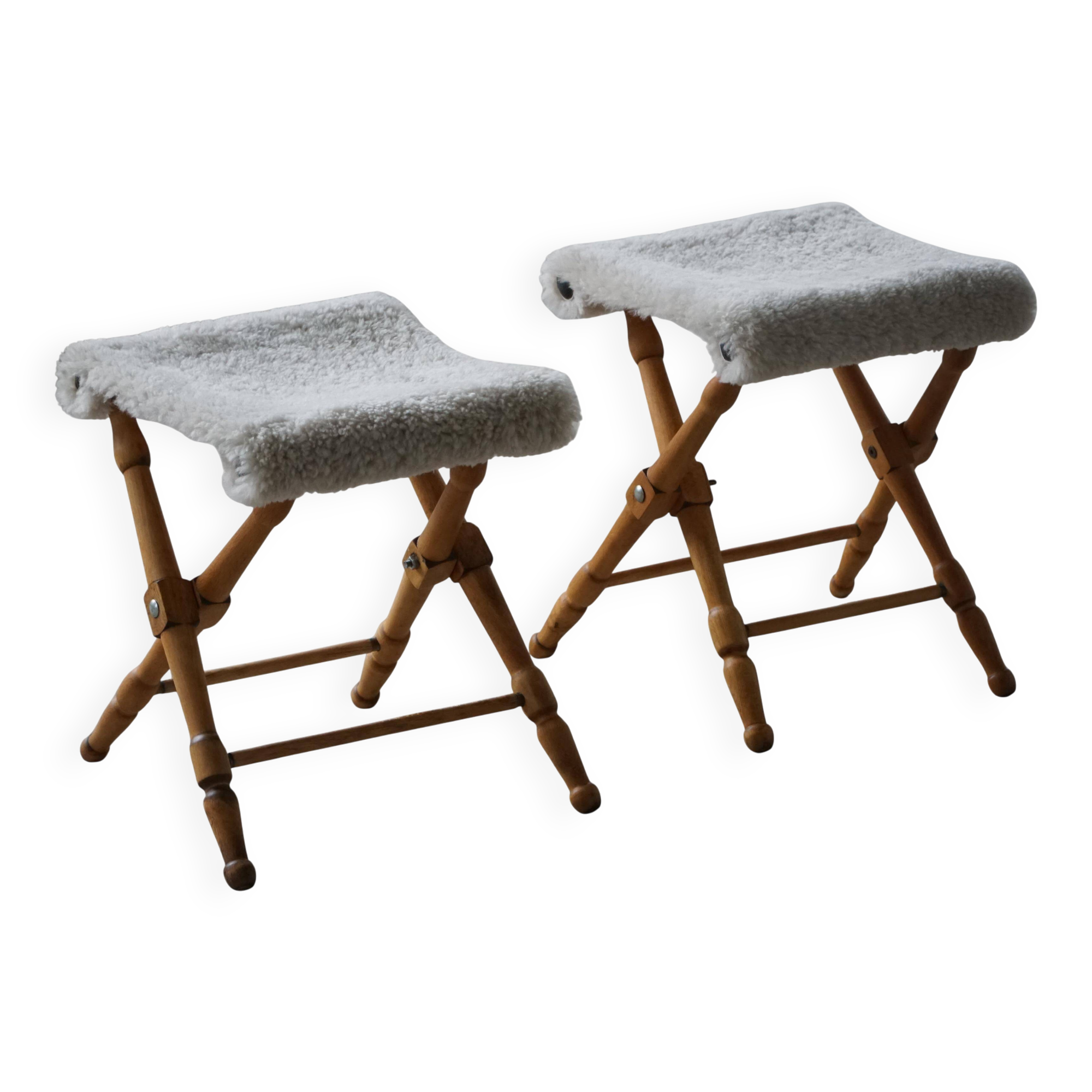 Pair of Danish mid-century folding stools with sheepskin upholstery, 1960.