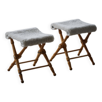 Pair of Danish mid-century folding stools with sheepskin upholstery, 1960.