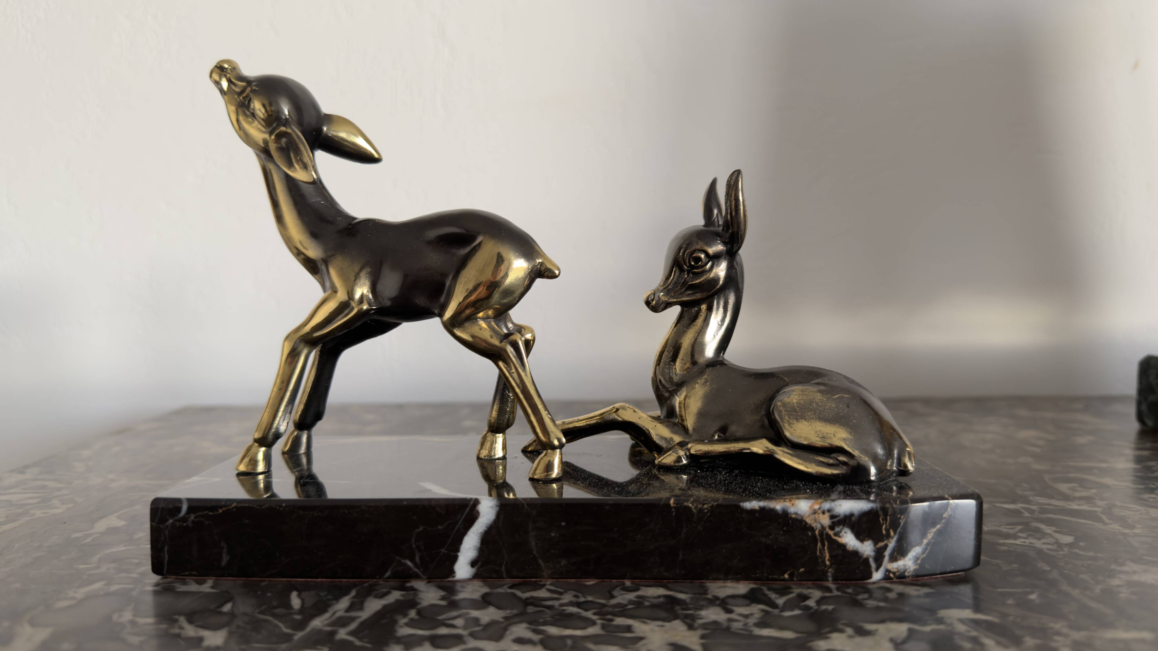 Art Deco bookends "Doe & Fawn" in black marble and gold metal