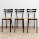 Set of 3 mid-century Italian stackable chairs in black steel and wood, made in Italy, 1970s.