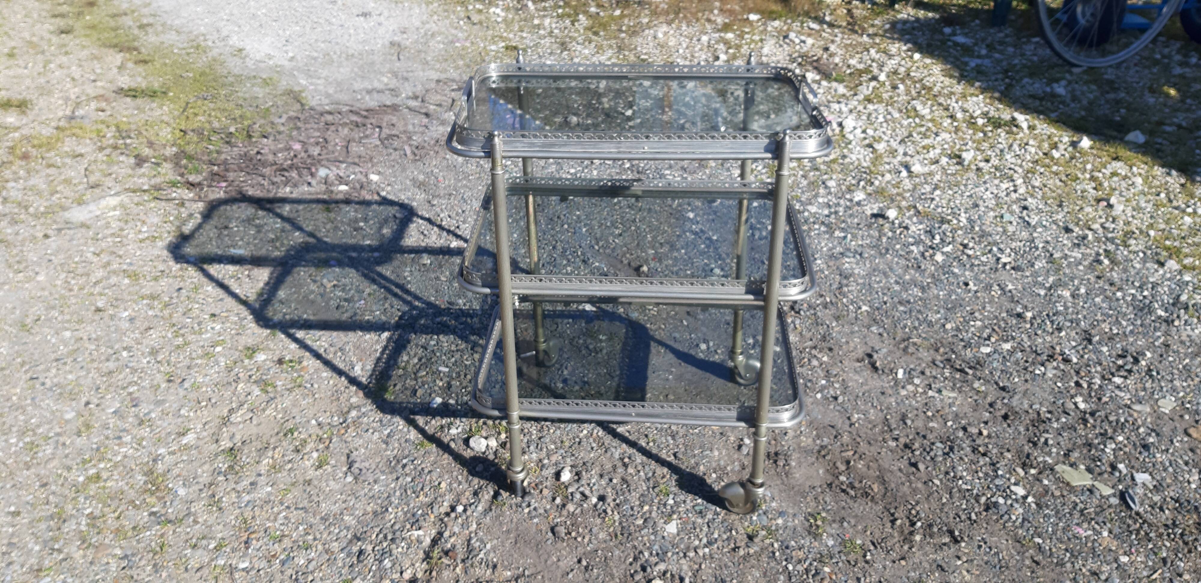 Rolling service silver metal and bluish glass