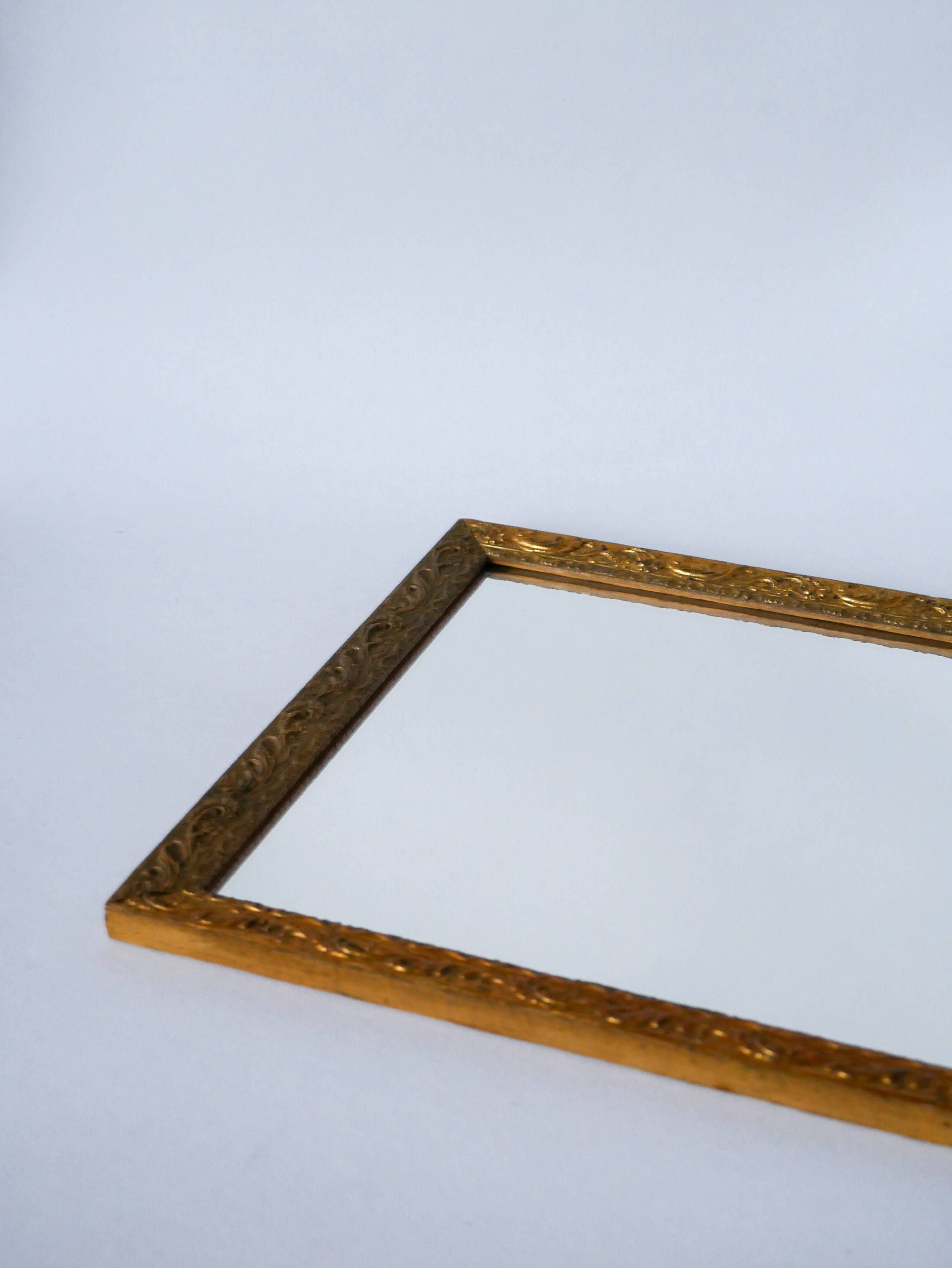 20th century wooden and gilded stucco mirror