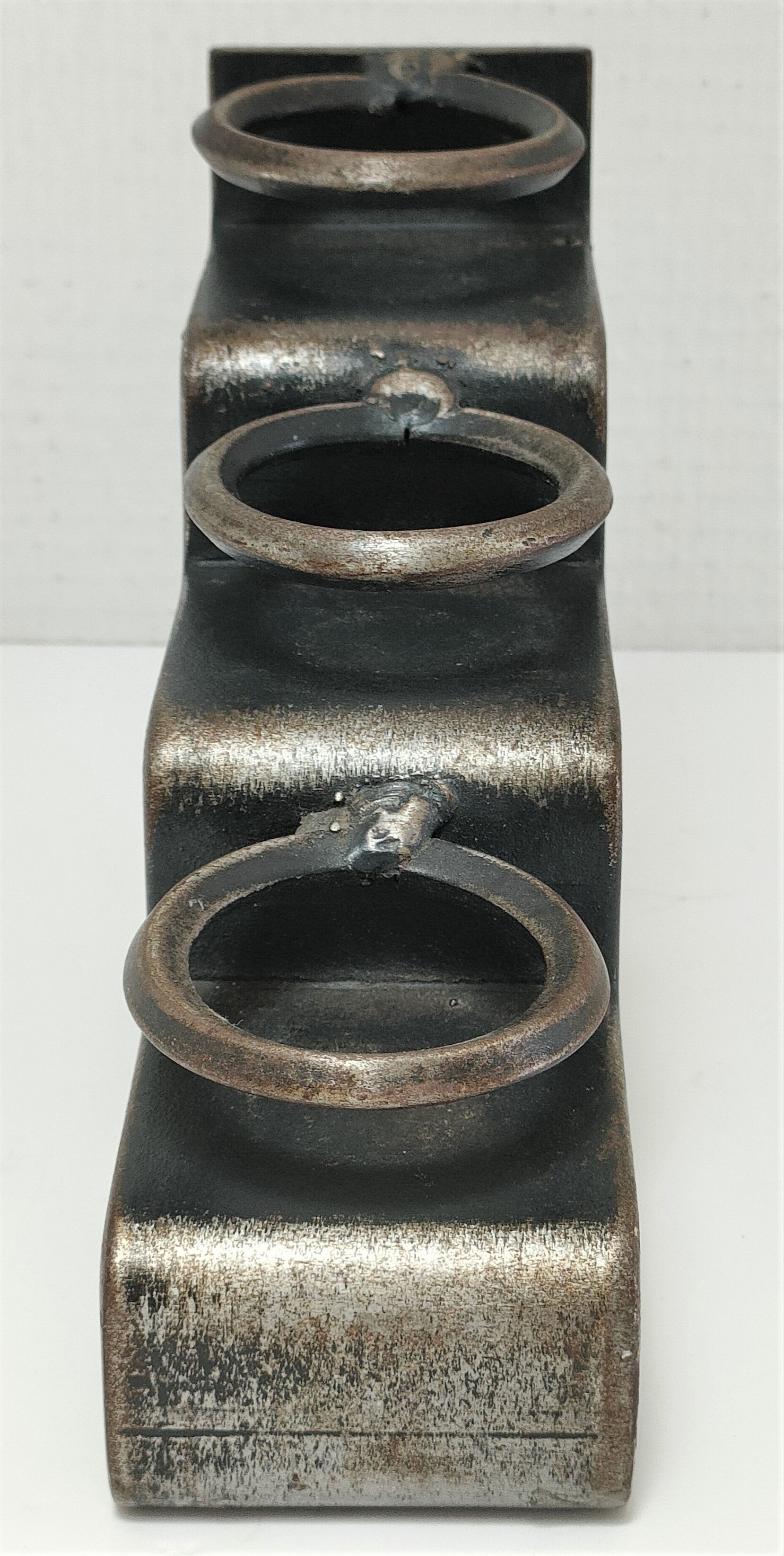 Sculptural candle holder patinated steel design 80s